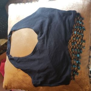 Crop top with turquoise netting below top.